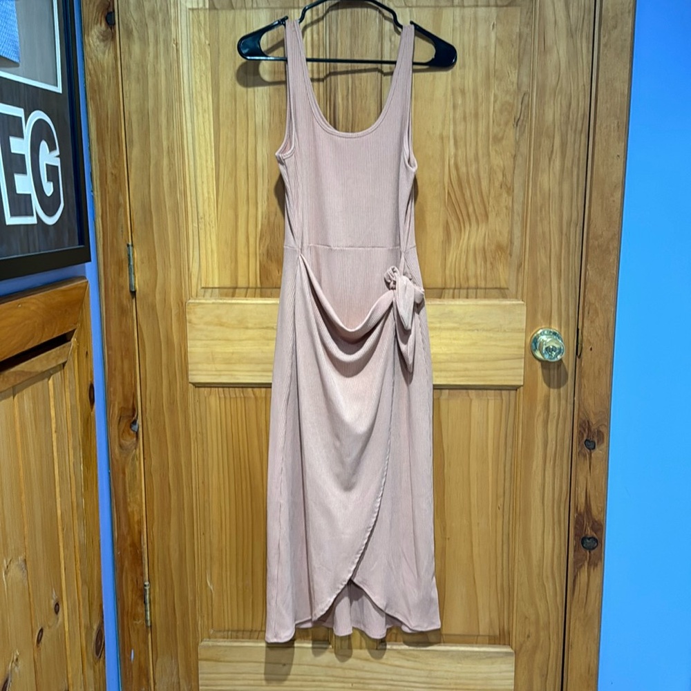 Large summer dress adjustable by bow in front. Never worn